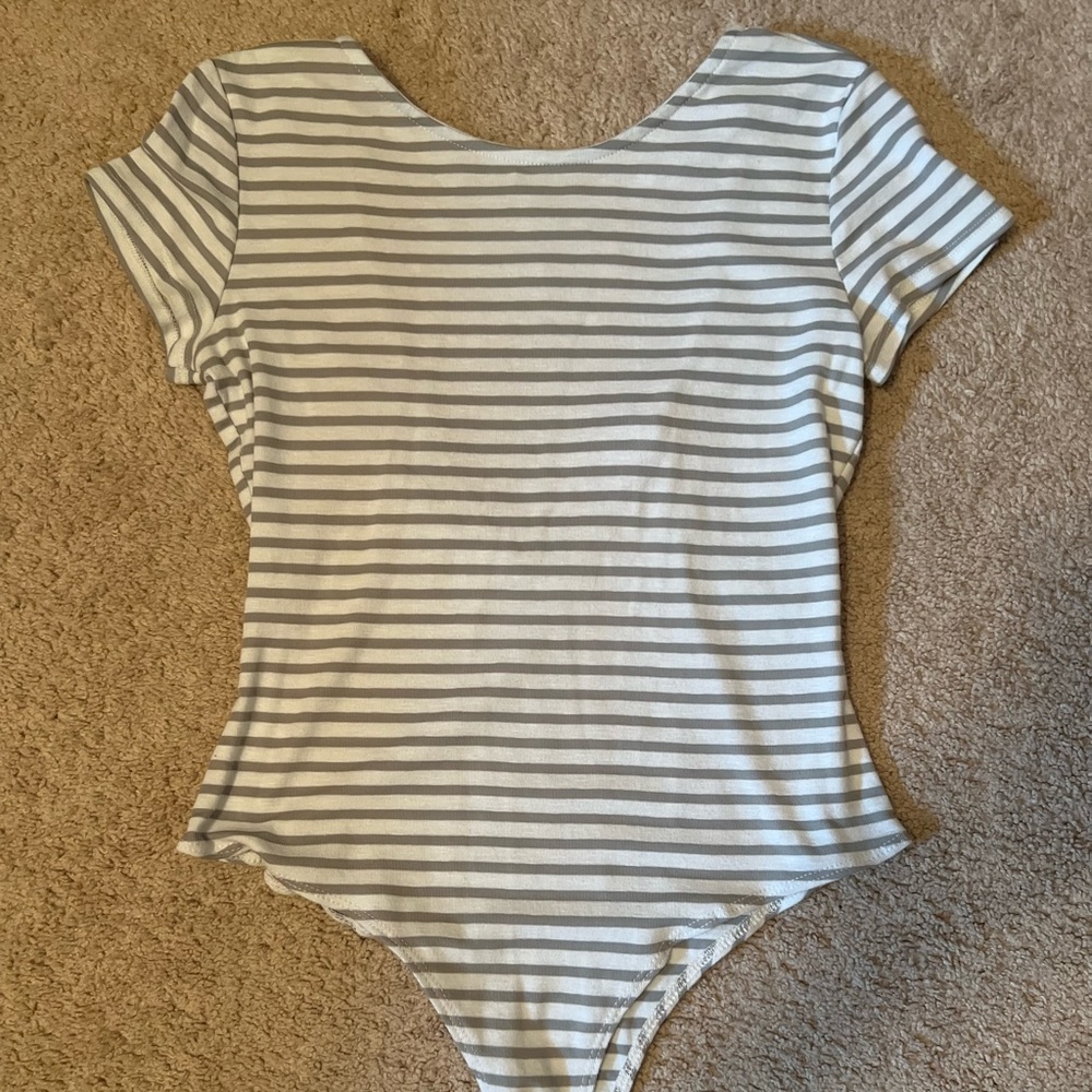 Striped body suit with an open back